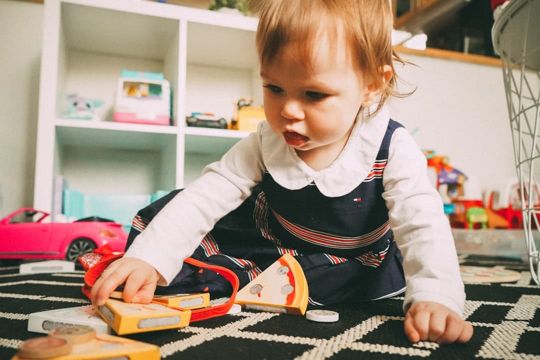 Child exploring in a bright playroom
